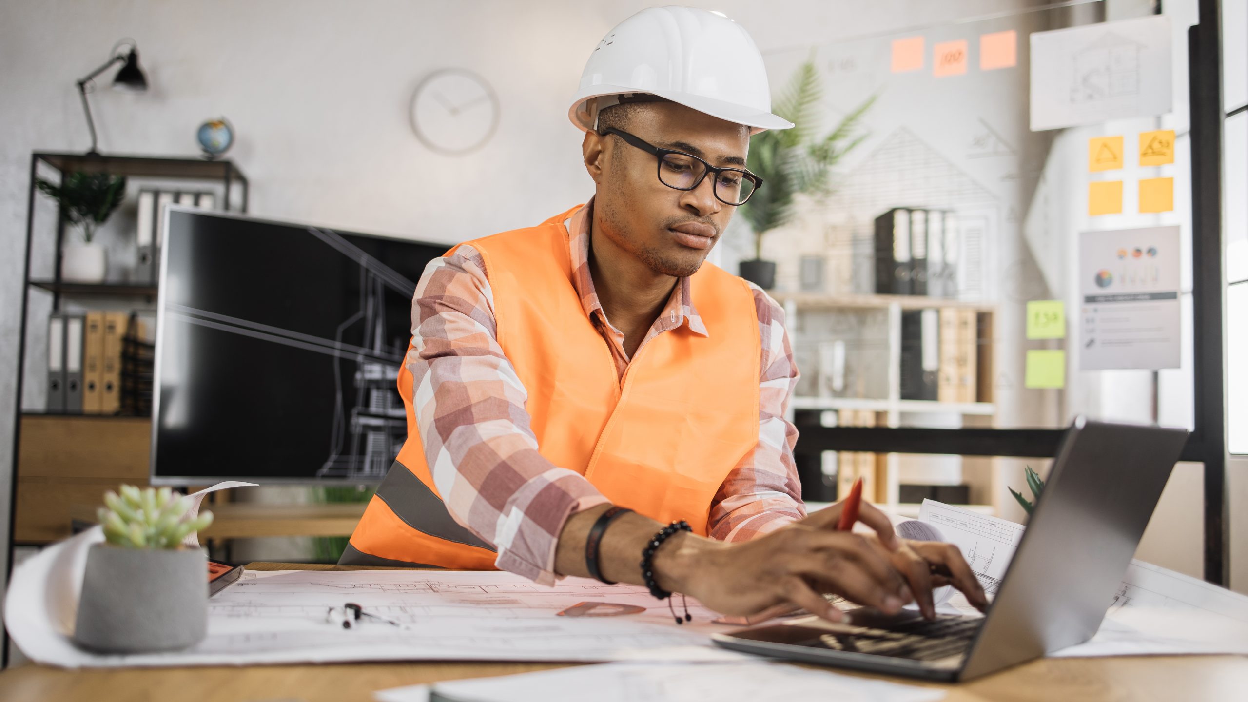 Focused african american man worker creating new b 2023 11 27 05 01 16 utc